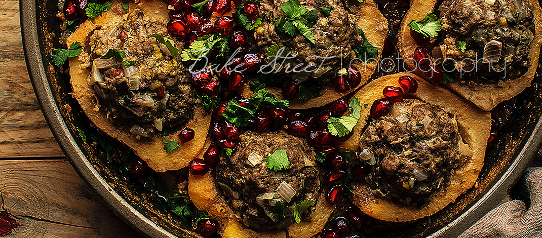 Lamb stuffed quinces with pomegranate and cilantro