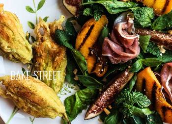 Stuffed squash blossoms with grilled peach salad